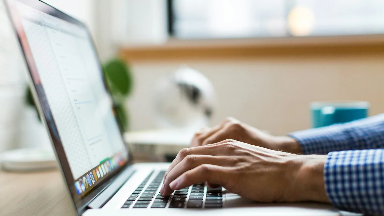 A course creator building lesson material on a laptop
