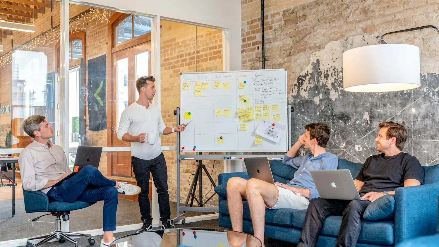 A marketing team mapping out a campaign on a whiteboard